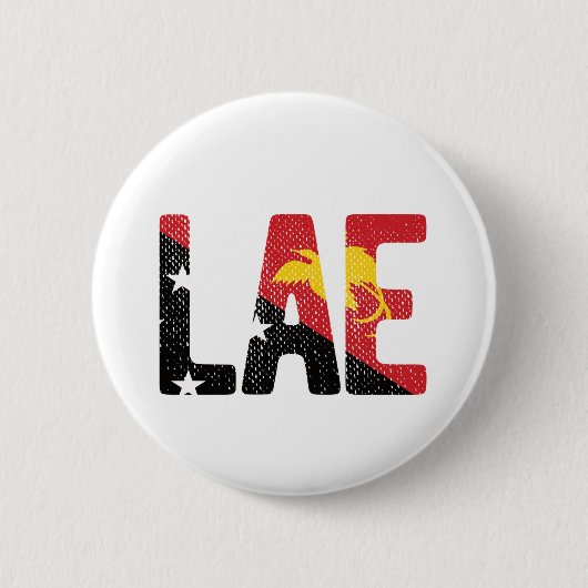 パプアニューギニア国旗を掲げる 缶バッジ (正面)