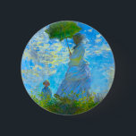 パラソルのあるモネの女性 缶バッジ<br><div class="desc">クロード・モネの妻カミーユがパラソルを持ち、彼らの息子ジャンが夏の日の風に乗って緑の野原を散歩する家族のボタンで吹す鮮やか。印象派素晴らしや芸術のファンのためのモネフランスのット贈り物。</div>