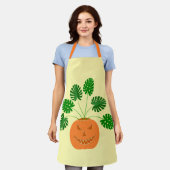 パンプキンのハロウィーンモンステラ植物 エプロン (着用した状態)