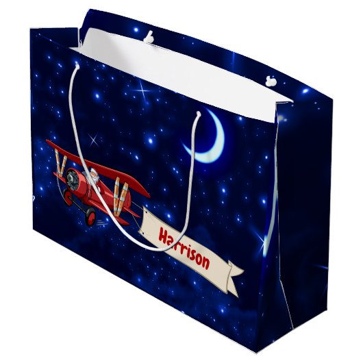 パーソナライズされた赤い飛行機とサンタ、メリークリスマス ラージペーパーバッグ (裏面アングル)