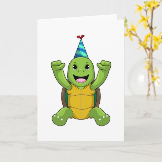 パーティー帽をかぶった誕生日のカメ カード (黄色い花)