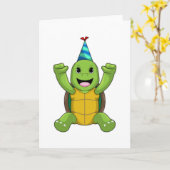 パーティー帽を被った誕生日のカメ カード (黄色い花)
