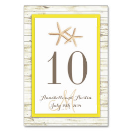 ヒトデは木製のビーチの熱帯結婚式に水漆喰を塗りました テーブルナンバー