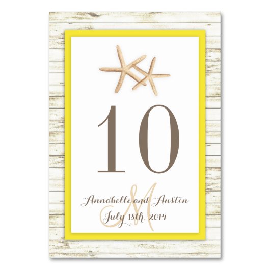 ヒトデは木製のビーチの熱帯結婚式に水漆喰を塗りました テーブルナンバー (正面)