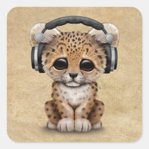 ヒョウのカブスかわいいDjの身に着けているヘッドホーン スクエアシール