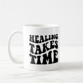 ヒーリングには時間がかかる コーヒーマグカップ (左)