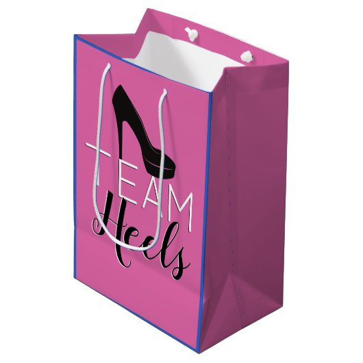 ヒールまたはホイールチームのピンク|青い性別の表示 ミディアムペーパーバッグ (正面アングル)