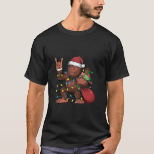 ビッグフットサンタクリスマスツリーライトおもしろいクリスマスSas Tシャツ