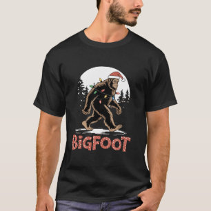 ビッグフットサンタクリスマスツリーライトおもしろいクリスマスSas Tシャツ