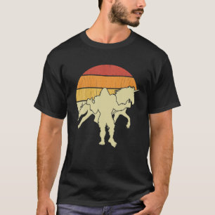 ビッグフット歩くユニコーンホースライディングおもしろいサスカット Tシャツ