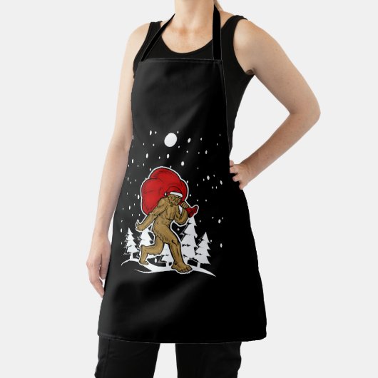 ビッグフートクリスマスシャツホリデーパーティイエティTシャツ エプロン (インサイチュ)