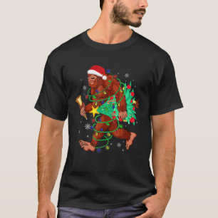 ビッグフ運ートのクリスマスツリーサスカッチ信者 Tシャツ