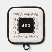 ビブ前向きス保スマイル追加イニシャルブラック 鍋敷き (正面)