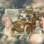 ビンテージクリスマスカード | Santa vintage car Cherubs シーズンポストカード<br><div class="desc">ヴィンテージビクトリアンクリスマスカードは必ずギグとスマイル。これらのビクトリアンスタイルのクリスマスグリーティング与えカードは、19世紀のクリスマスの魅力とホリビクトリアンデイの願いしゃれているにアンティークの時代を持つことができる。車を愛するすべての人のための自動車テーマ付きのヴィンテージ車のクリスマスカードも2つの可愛い救済cherubsのサンタクロース。</div>