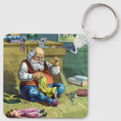 ビンテージクリスマス、サンタクロースが人形のおもちゃを作る キーホルダー (裏面)