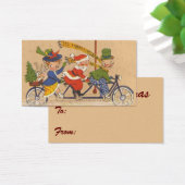 ビンテージクリスマス、ビクトリア時代の自転車に乗るサンタクロース (デスク)