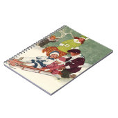 ビンテージクリスマス、雪の中で子供たちがスレッドに乗って遊ぶ ノートブック (左側)