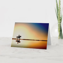 ビーチのシルエットの挨拶状の馬そしてライダー カード