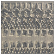 ビーチの砂の写真の生地のタイヤトラック