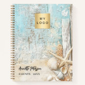 ビーチの青い砂の星型の貝殻のビジネス ロゴ ノートブック (正面)