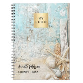 ビーチの青い砂の星型の貝殻のビジネス ロゴ ノートブック (正面)