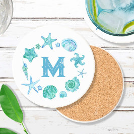 ビーチ沿岸の貝殻とヒトデモノグラムの コースター