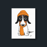 ビーニー犬 |かわいいピエバルドダシュント キャンバスプリント<br><div class="desc">オレンジ色のビーニーとスカーフを着た黒、タンと白のPiebald Dachshandの漫画のスタイルスケッチ。ウィーナー犬を愛するすべての人のためのおもしろいキャンバスのプリント。さらに可愛いアニマルアートと犬好きのイラストのためにジェンのドードルワールドを訪れる。</div>