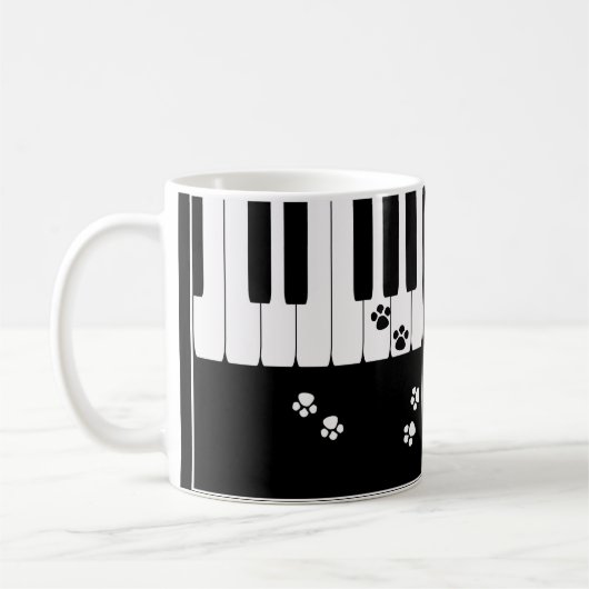 ピアノの鍵と猫の足の肉球 コーヒーマグカップ (左)