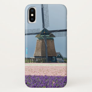 ピンクおよび紫色の花が付いている伝統的な風車 iPhone X ケース