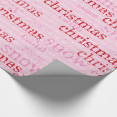 ピンクおよび赤いクリスマスおよび雪の単語の休日 ラッピングペーパー (角)