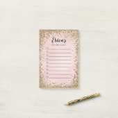 ピンクおよび金ゴールドのグリッターの個人的な大騒ぎのチェックリスト ポストイット (デスク上)