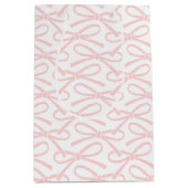 ピンクかわいらしの弓パターン白い中抱き枕 ミディアムペーパーバッグ (正面)