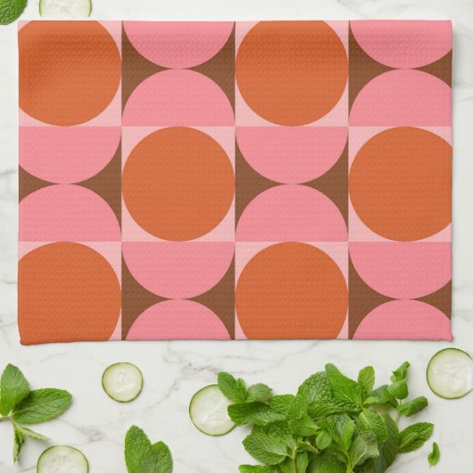 ピンクとオレンジ色の正方形のミッドセンチュリーサークル キッチンタオル (折り畳み)