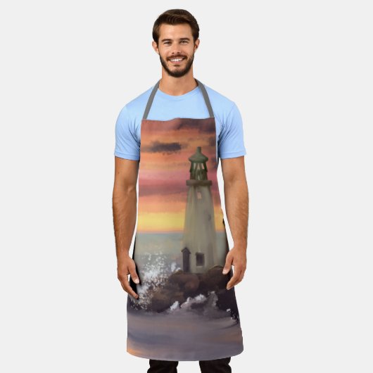 ピンクとオレンジ色の空を持つ海岸灯台 エプロン (着用した状態)