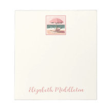 ピンクとクリームのビーチ椅子と傘