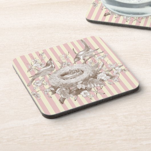 ピンクとクリームの背景のラ・プティ・ファミリー コースター (左側)