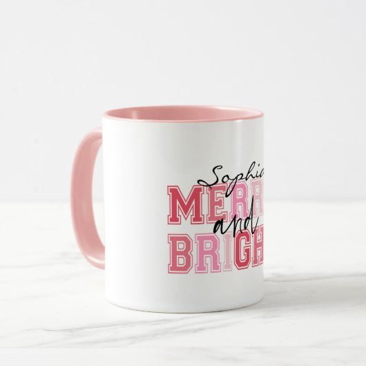ピンクと明メリーるいタイポグラフィグルービークリスマス マグカップ (正面左)