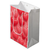 ピンクと赤いハートバブルパターン ミディアムペーパーバッグ (正面アングル)