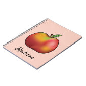 ピンクに赤い漫画のリンゴと名前をカスタムする ノートブック (左側)