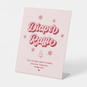 ピンクのクリスマスベビーシャワーおむつラッフル 台座サイン (正面)