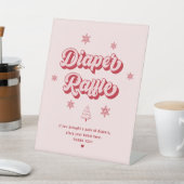 ピンクのクリスマスベビーシャワーおむつラッフル 台座サイン (インサイチュ)