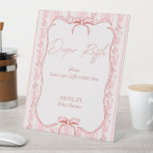 ピンクのストライプは赤ちゃんシャワーおむつラッフルサインを弓 台座サイン (インサイチュ)