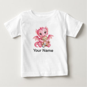 ピンクのテディベアを抱っこするオーダーメイドの赤ちゃんドラゴン ベビーTシャツ