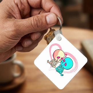 ピンクのハートの中でキスをするロマンチックなスケルトンのカップル キーホルダー
