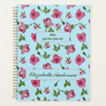 ピンクのバラの表面パターンデザインオン青プランナー