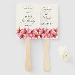 ピンクのプルメリアの花を持っている手のファン ハンドファン