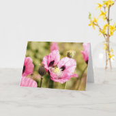 ピンクのポピーのノートに載る カード (黄色い花)