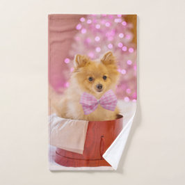 ピンクのリボンが可愛い犬のクリスマス写真 ハンドタオル