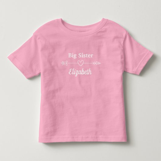 ピンクの大きなハート付き姉矢印ボヘミアン トドラーTシャツ (正面)
