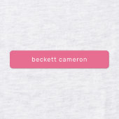 ピンクの子供がアイロンを衣類ラベルに付ける ラベル (デザイン1)